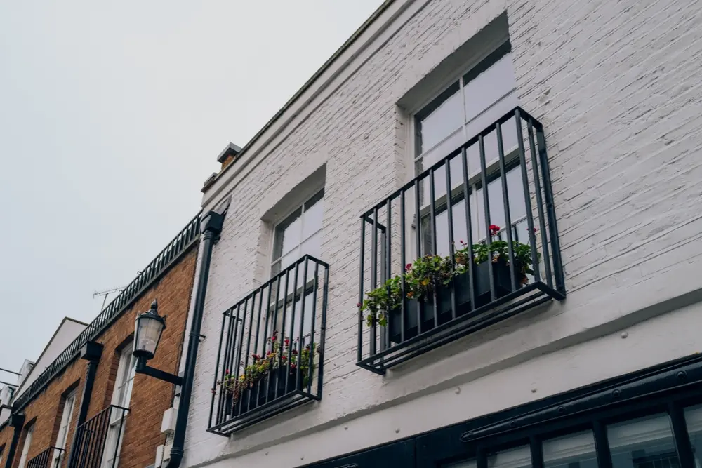 metal Juliet balcony brick house